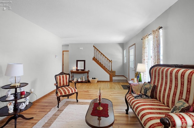 408 Forest St, Lagrange, OH 44050 - living room with stairway and wood finished floors