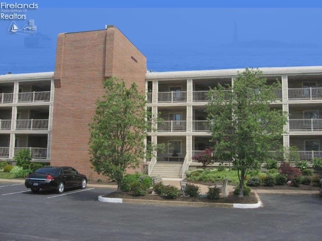 1507 Cleveland Rd Unit 423, Huron, OH 44839 - view of apartment building / complex with uncovered parking