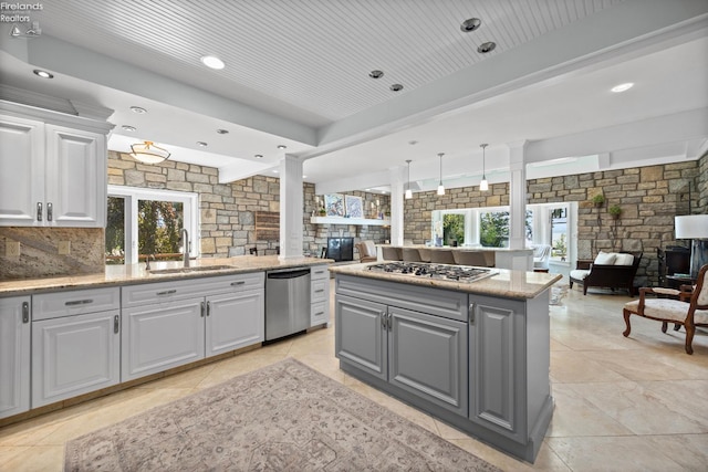 1115 Cedar Point Rd, Sandusky, OH 44870 - kitchen with stainless steel appliances, open floor plan, gray cabinetry, a kitchen island, and white cabinets