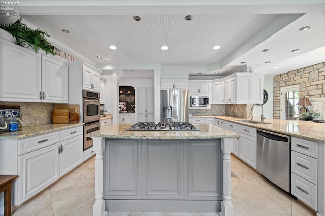 1115 Cedar Point Rd, Sandusky, OH 44870 - kitchen with appliances with stainless steel finishes, backsplash, white cabinetry, and recessed lighting