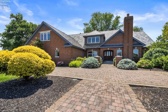1115 Cedar Point Rd, Sandusky, OH 44870 - view of front facade with brick siding and a chimney