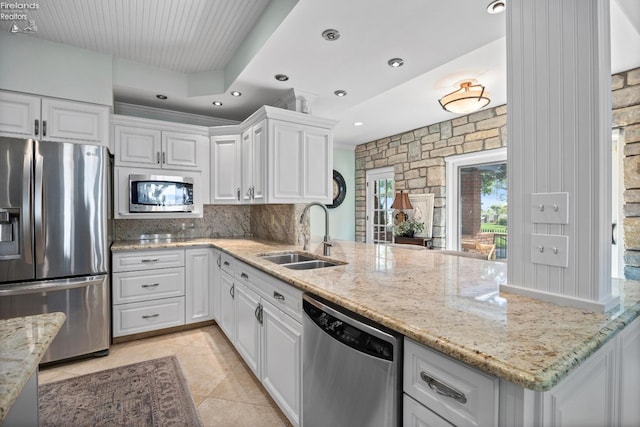 1115 Cedar Point Rd, Sandusky, OH 44870 - kitchen featuring stainless steel appliances, white cabinets, tasteful backsplash, and recessed lighting