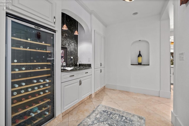 1115 Cedar Point Rd, Sandusky, OH 44870 - wine area with wine cooler, arched walkways, and bar area