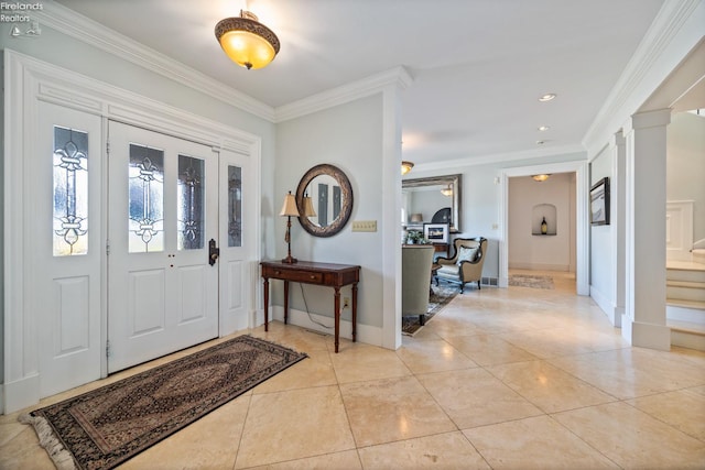 1115 Cedar Point Rd, Sandusky, OH 44870 - foyer featuring crown molding, light tile patterned flooring, stairway, ornate columns, and recessed lighting