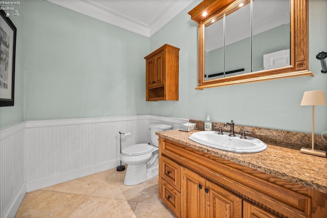 1115 Cedar Point Rd, Sandusky, OH 44870 - bathroom featuring vanity, wainscoting, tile patterned floors, and ornamental molding