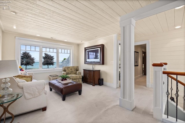1115 Cedar Point Rd, Sandusky, OH 44870 - living area with wooden ceiling, carpet floors, recessed lighting, a water view, and decorative columns
