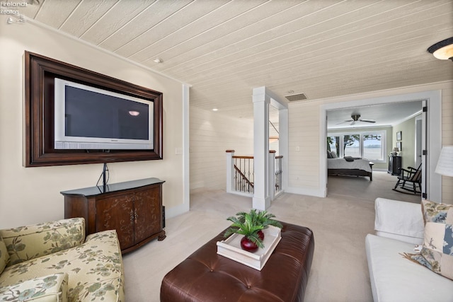 1115 Cedar Point Rd, Sandusky, OH 44870 - carpeted living area with wood ceiling, ceiling fan, and wooden walls
