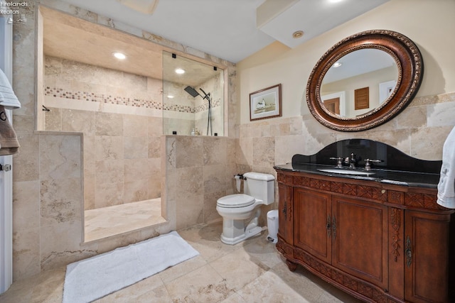 1115 Cedar Point Rd, Sandusky, OH 44870 - full bathroom with tile walls, a walk in shower, and vanity