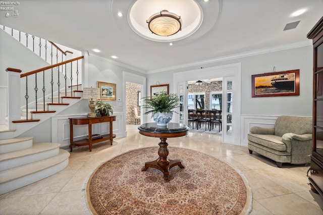 1115 Cedar Point Rd, Sandusky, OH 44870 - foyer entrance with crown molding, stairs, a decorative wall, recessed lighting, and wainscoting