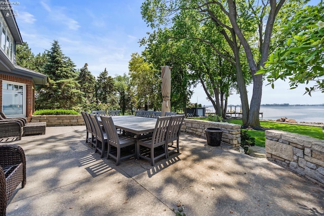 1115 Cedar Point Rd, Sandusky, OH 44870 - view of patio with outdoor dining area and a water view