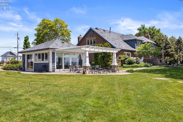 1115 Cedar Point Rd, Sandusky, OH 44870 - rear view of property with a pergola, a yard, a patio area, and a chimney