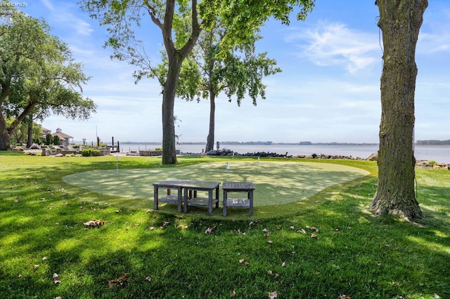 1115 Cedar Point Rd, Sandusky, OH 44870 - view of home's community with a putting area, a water view, and a lawn