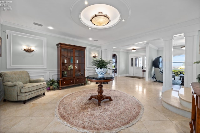 1115 Cedar Point Rd, Sandusky, OH 44870 - entryway with ornate columns, a decorative wall, ornamental molding, recessed lighting, and light tile patterned flooring
