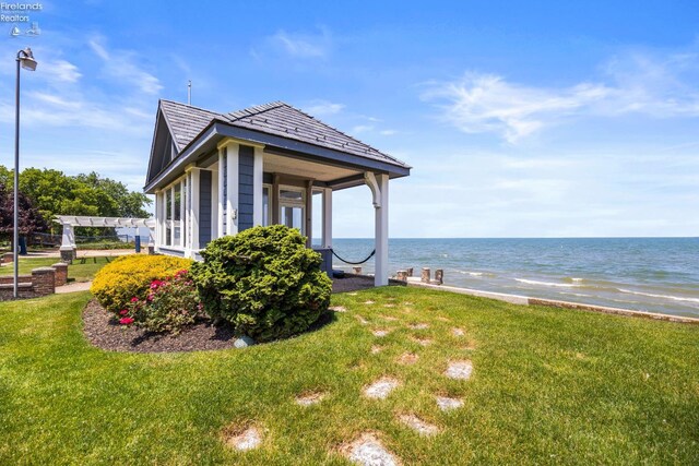 1115 Cedar Point Rd, Sandusky, OH 44870 - view of side of property with a yard and a water view
