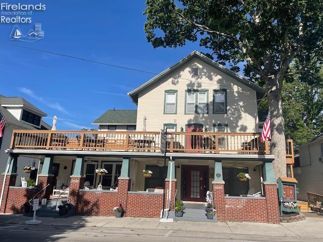 317 Maple Unit 17, Lakeside, OH 43440 - view of front facade with a porch and brick siding