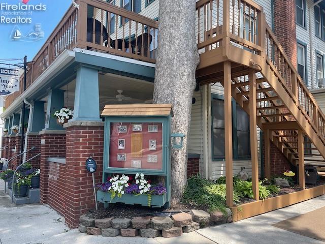 317 Maple Unit 17, Lakeside, OH 43440 - property entrance featuring brick siding and a balcony