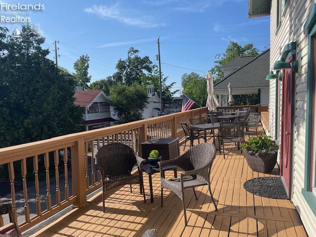 317 Maple Unit 17, Lakeside, OH 43440 - wooden terrace with outdoor dining area