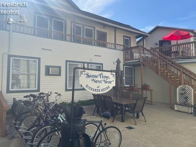 317 Maple Unit 17, Lakeside, OH 43440 - back of property with outdoor dining space and stairway