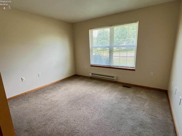 3106 E County Road 50, Tiffin, OH 44883 - carpeted empty room with baseboard heating and baseboards
