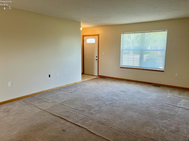 3106 E County Road 50, Tiffin, OH 44883 - spare room featuring carpet flooring