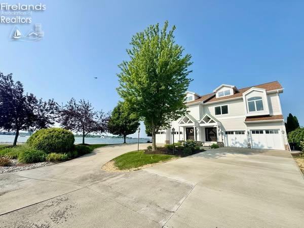 2822 N Noreaster Cove Dr, Port Clinton, OH 43452 - view of front of property featuring concrete driveway and an attached garage