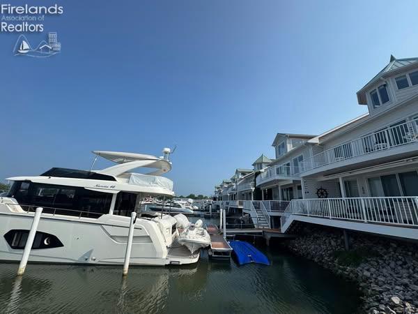 2822 N Noreaster Cove Dr, Port Clinton, OH 43452 - dock featuring a water view