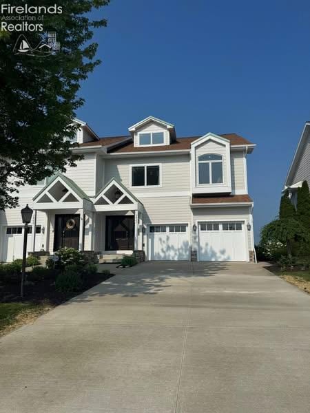 2822 N Noreaster Cove Dr, Port Clinton, OH 43452 - view of front of house featuring a garage and concrete driveway