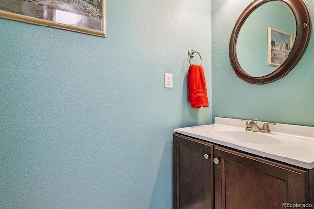 693 Delwood Ct, Highlands Ranch, CO 80126 - bathroom with vanity and a textured wall