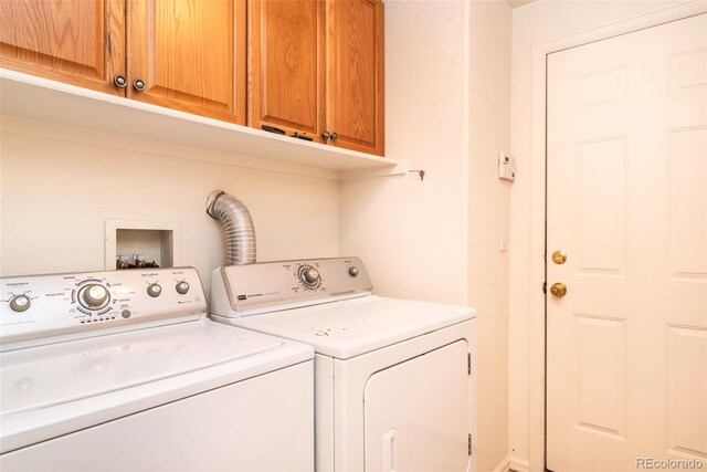 laundry area featuring cabinets and washing machine and dryer