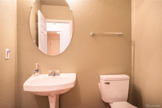 bathroom featuring toilet