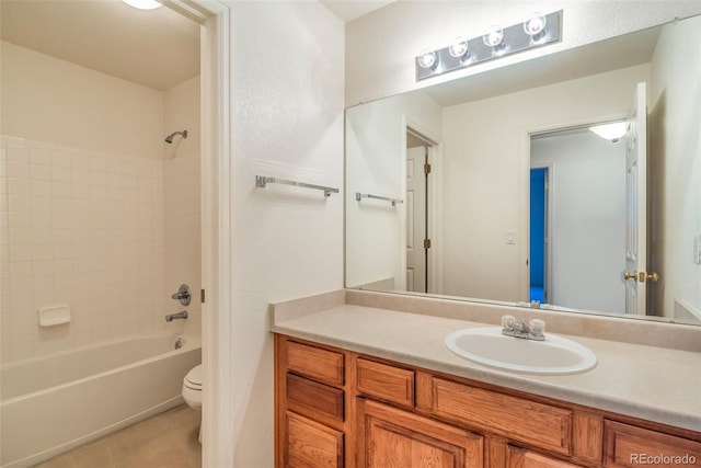 full bathroom with vanity, toilet, and tiled shower / bath