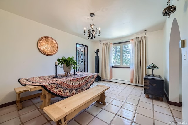 tiled dining space featuring an inviting chandelier and baseboard heating