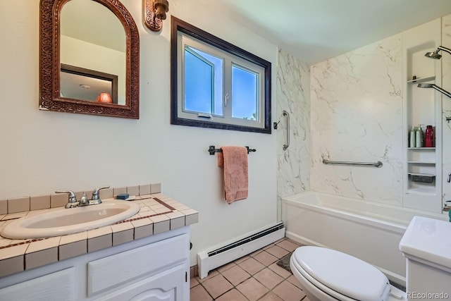 full bathroom featuring a baseboard heating unit, tile patterned floors, vanity, tiled shower / bath, and toilet