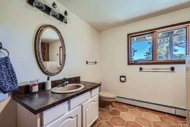 bathroom featuring vanity, baseboard heating, tile patterned flooring, and toilet