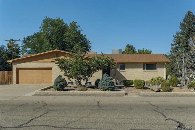 ranch-style home featuring a garage