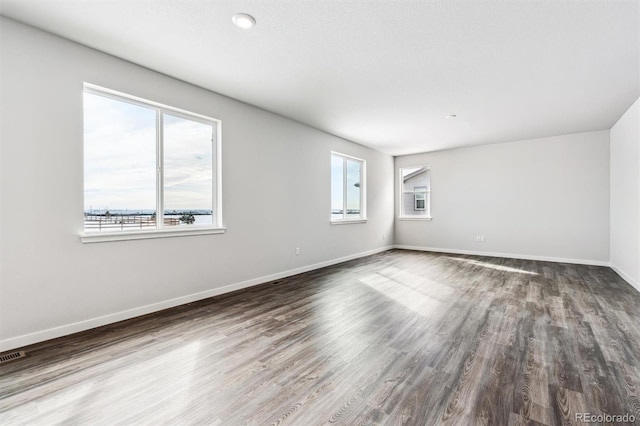 spare room with hardwood / wood-style floors