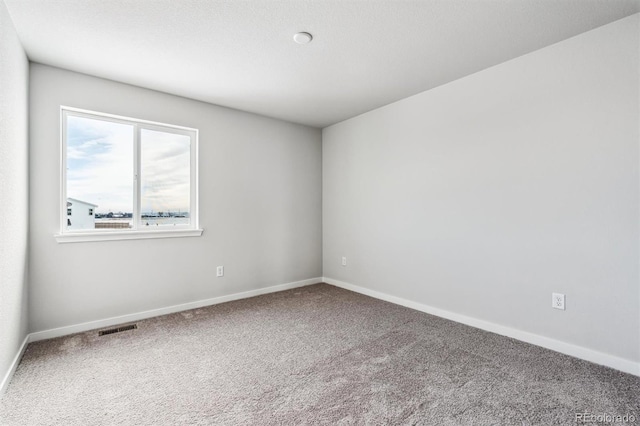 empty room featuring carpet flooring