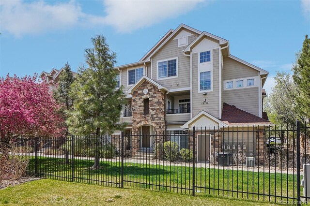 12711 Colorado Blvd Unit 1009, Thornton, CO 80241 - view of front of property featuring stone siding and a balcony