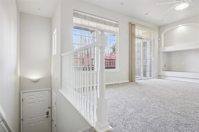 12711 Colorado Blvd Unit 1009, Thornton, CO 80241 - stairs with healthy amount of natural light, carpet flooring, a ceiling fan, and baseboards