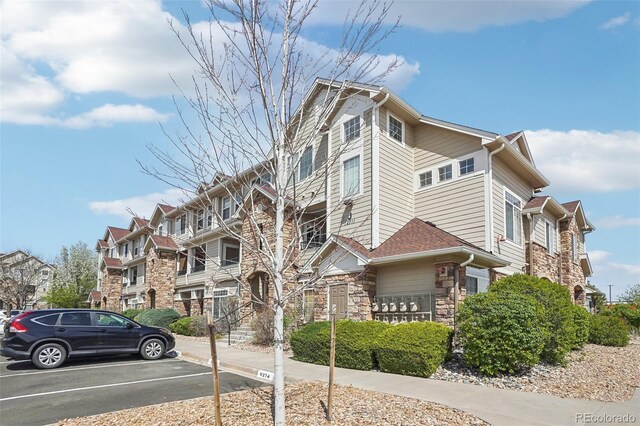 12711 Colorado Blvd Unit 1009, Thornton, CO 80241 - view of building exterior featuring uncovered parking