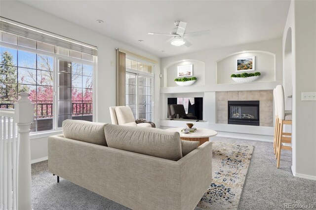 12711 Colorado Blvd Unit 1009, Thornton, CO 80241 - carpeted living room with a fireplace, ceiling fan, and baseboards