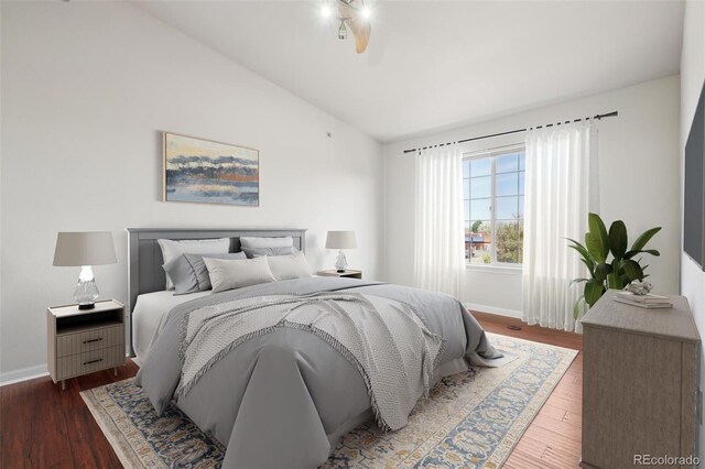 12711 Colorado Blvd Unit 1009, Thornton, CO 80241 - bedroom with vaulted ceiling, baseboards, and wood finished floors