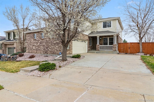 view of front of house with a porch, a garage, fence, concrete driveway, and brick siding