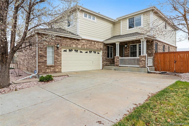 view of front facade featuring a porch, driveway, and brick siding