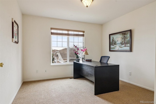 carpeted office with baseboards