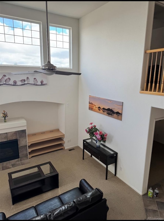 living area featuring carpet flooring and baseboards