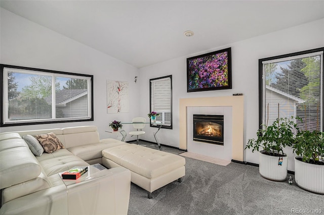 403 Captains Ct, Fort Collins, CO 80524 - living area featuring carpet flooring, vaulted ceiling, healthy amount of natural light, a fireplace, and baseboards