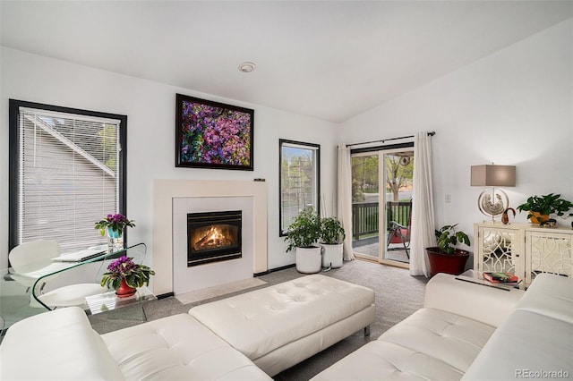 403 Captains Ct, Fort Collins, CO 80524 - carpeted living area with vaulted ceiling and a tile fireplace
