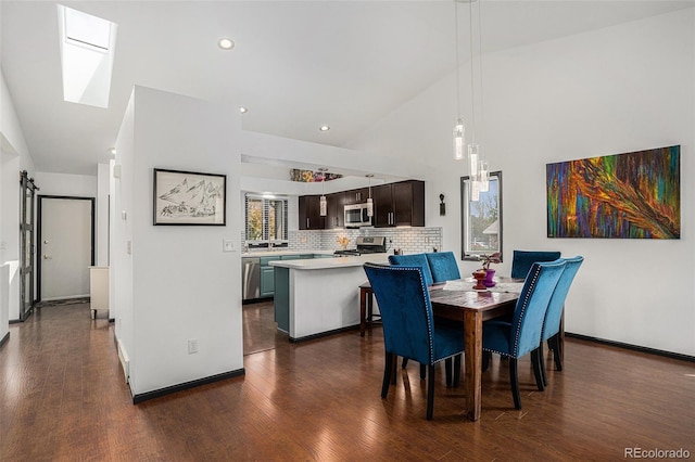 403 Captains Ct, Fort Collins, CO 80524 - dining area with high vaulted ceiling, dark wood-style flooring, a skylight, baseboards, and recessed lighting