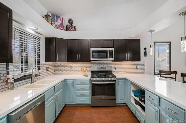 403 Captains Ct, Fort Collins, CO 80524 - kitchen with stainless steel appliances, a sink, decorative backsplash, and light countertops
